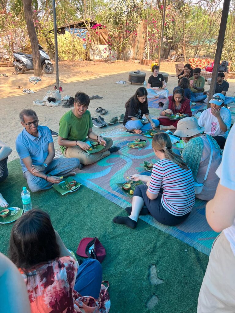 Co-Life students enjoying lunch with the Worli tribe in Aarey Forest.